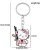 Brelok emaliowany Hello Kitty Buntowniczka z karabinem AKM